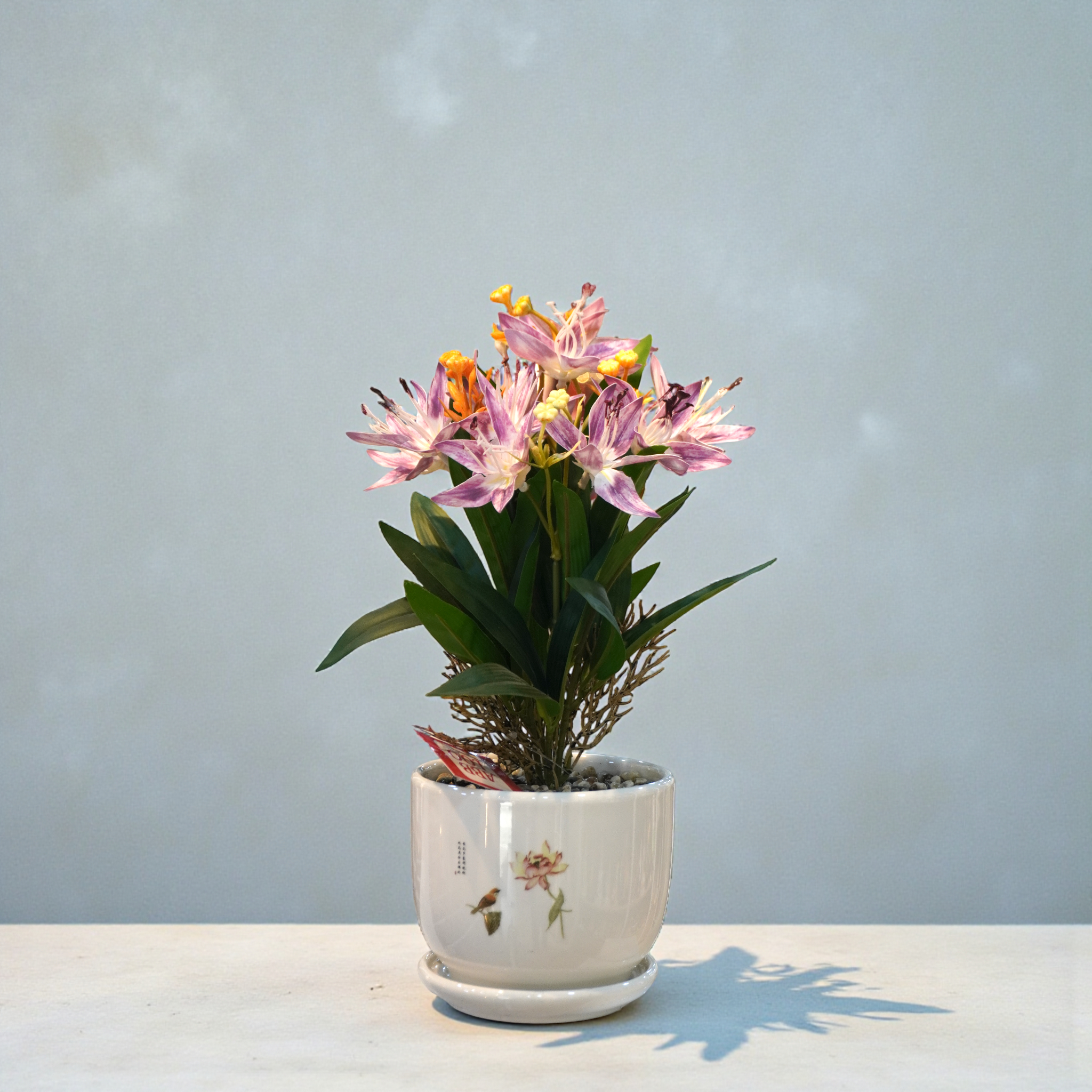 Lily Flower Arrangement In a Ceramic Pot