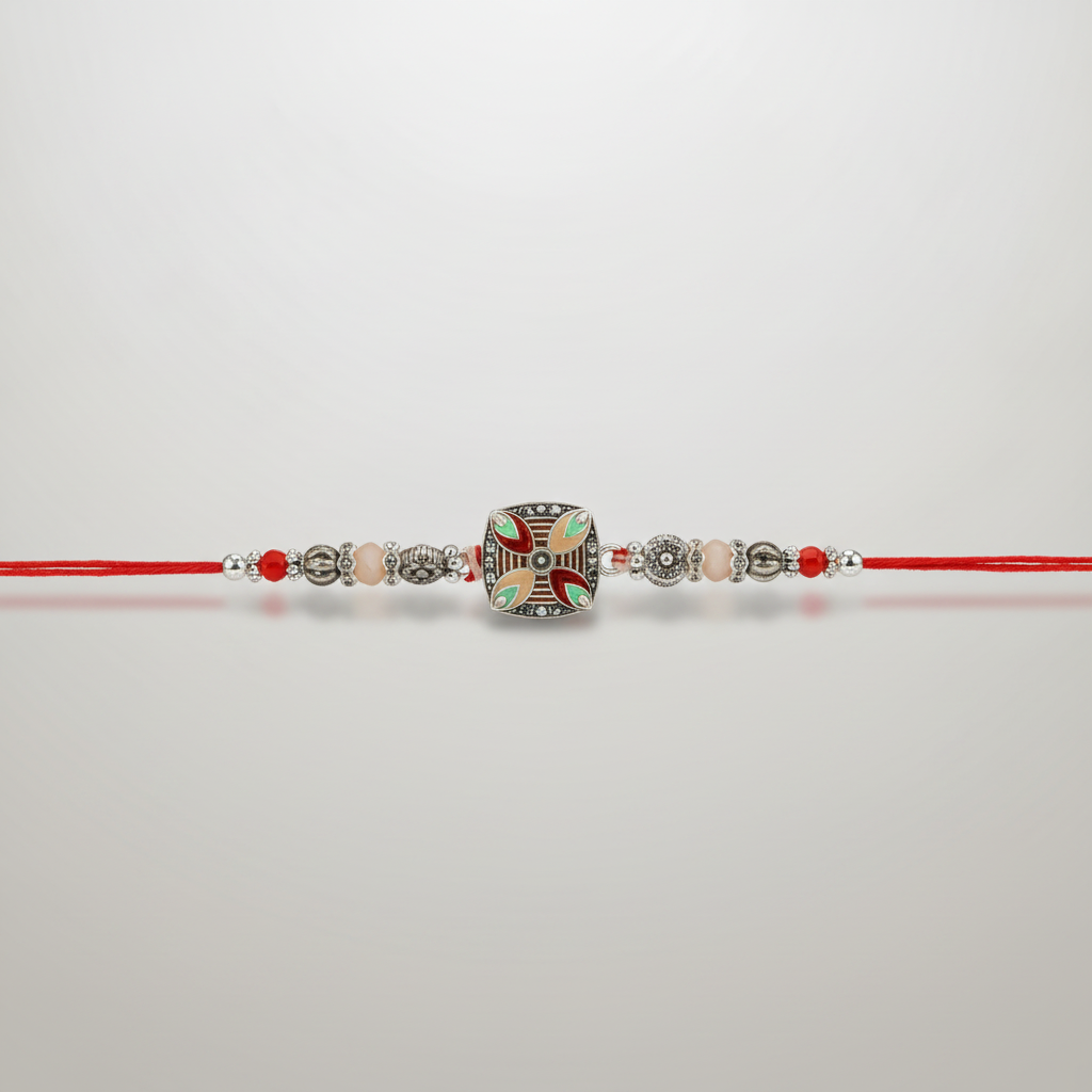 Traditional Silver & Meenakari Rakhi with Red Thread