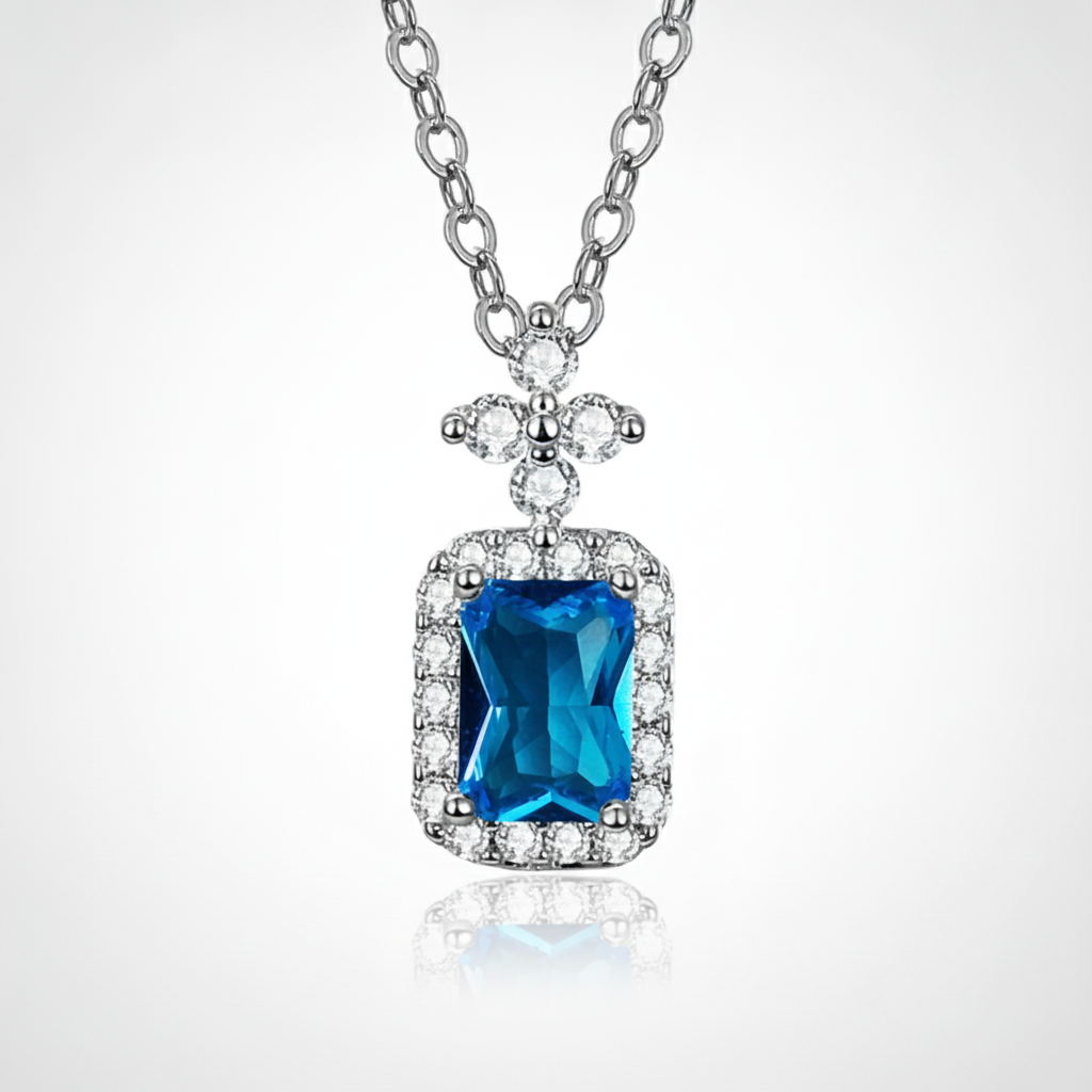 Blue Topaz Halo Pendant Necklace in Sterling Silver