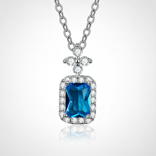 Blue Topaz Halo Pendant Necklace in Sterling Silver